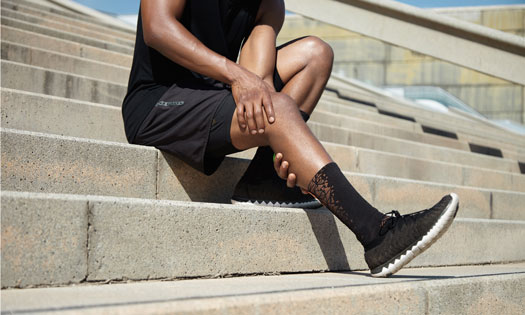 Athlete holding knee